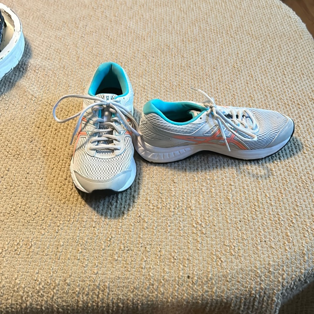 ASICS sneakers.